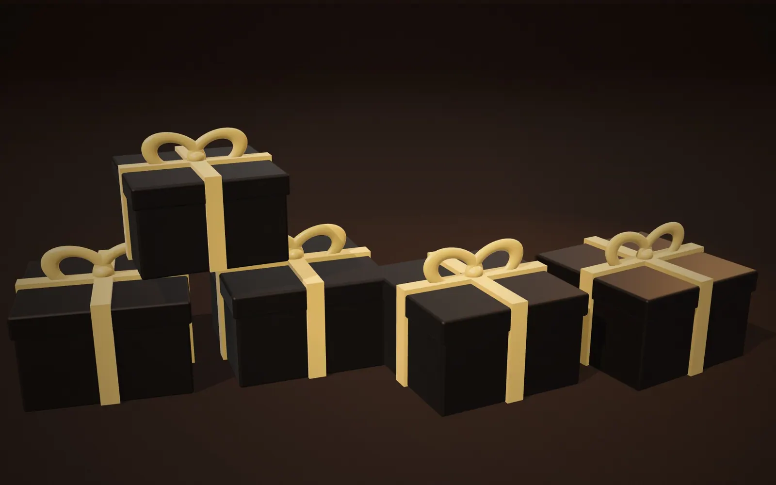 Stacked black Nero Bakes gift boxes tied with gold ribbon