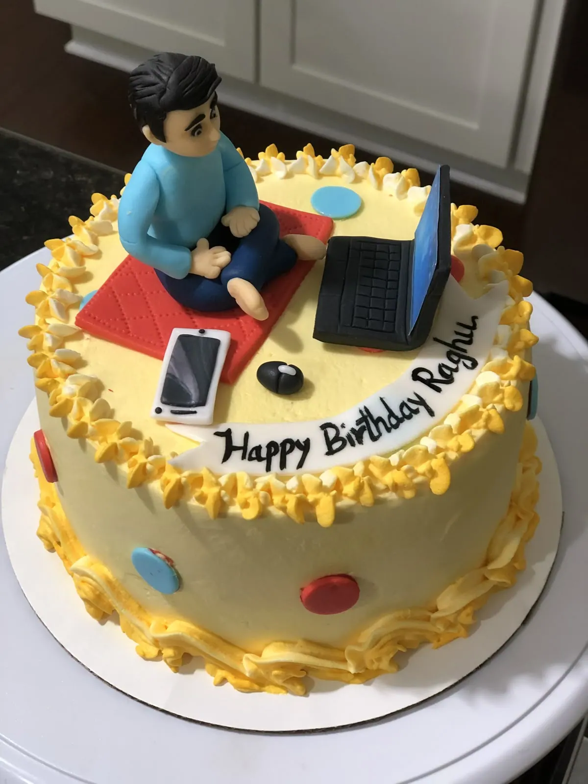 Birthday cake with a fondant figure and laptop — supplied design reference